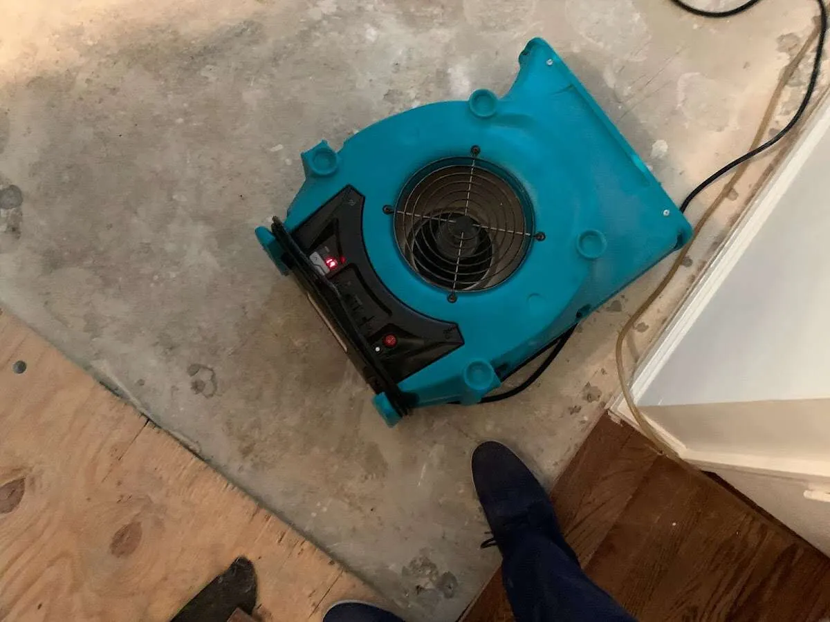 Air mover drying subfloor during Leak Detection & Repair in Fairland
